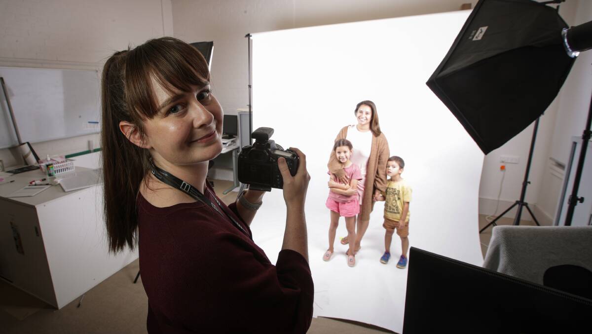 COMMUNITY CAPTURED: Photographer Ash Giffney with Beechworth family, Karla Florance, and her children Ava, 7, and Rafael , 4. Picture: JAMES WILTSHIRE