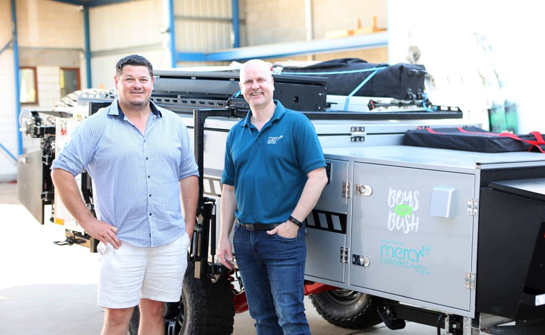 SUPPORTING OTHERS: Boys to the Bush chief executive Adam DeMamiel and Mercy Connect chief executive Trent Dean in front of the new mobile camper trailer.