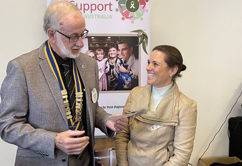 SCHOLARSHP WINNER: Meg Torpey receiving her Dr John McDonald Medical Scholarship from incoming Albury-Hume Rotary Club president Graham Fuller.