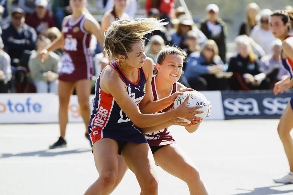 Mia Lavis tussles for possession during last season's 17/U grand final between Wodonga Raiders and Wodonga Bulldogs. Picture by Ash Smith