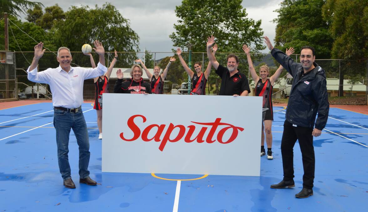 Saputo managers John Furphy and Wael Hamed with Richie Kreuzer, Cindy Ryder and the Bombers netballers.
