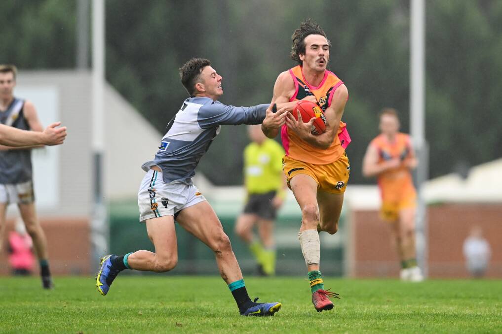 Will Maclean gets his hands on the footy ahead of Lavington's Jake O'Brien. Picture: MARK JESSER