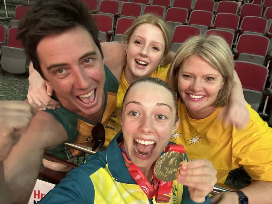 Nigel, Evie, Mia and Amanda Lavis celebrate Australia's win in Tobago.