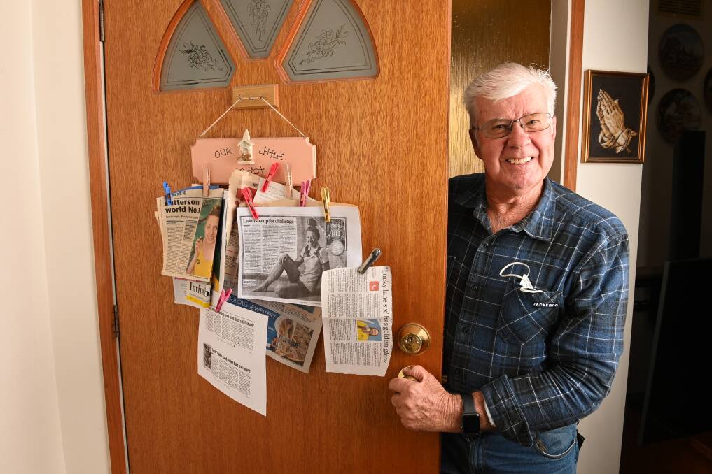 Bob King and his collection of press cuttings detailing grand-daughter Lakeisha Patterson's swimming successes. Picture: MARK JESSER