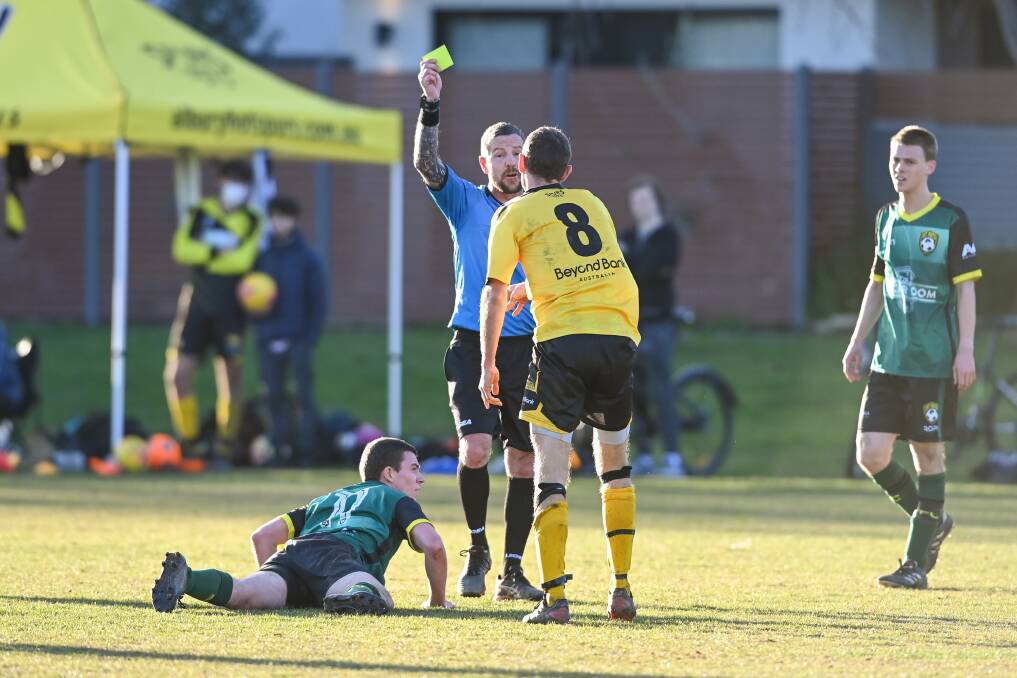 Hotspurs coach James Eggleston goes into the book for a late tackle. Picture: MARK JESSER