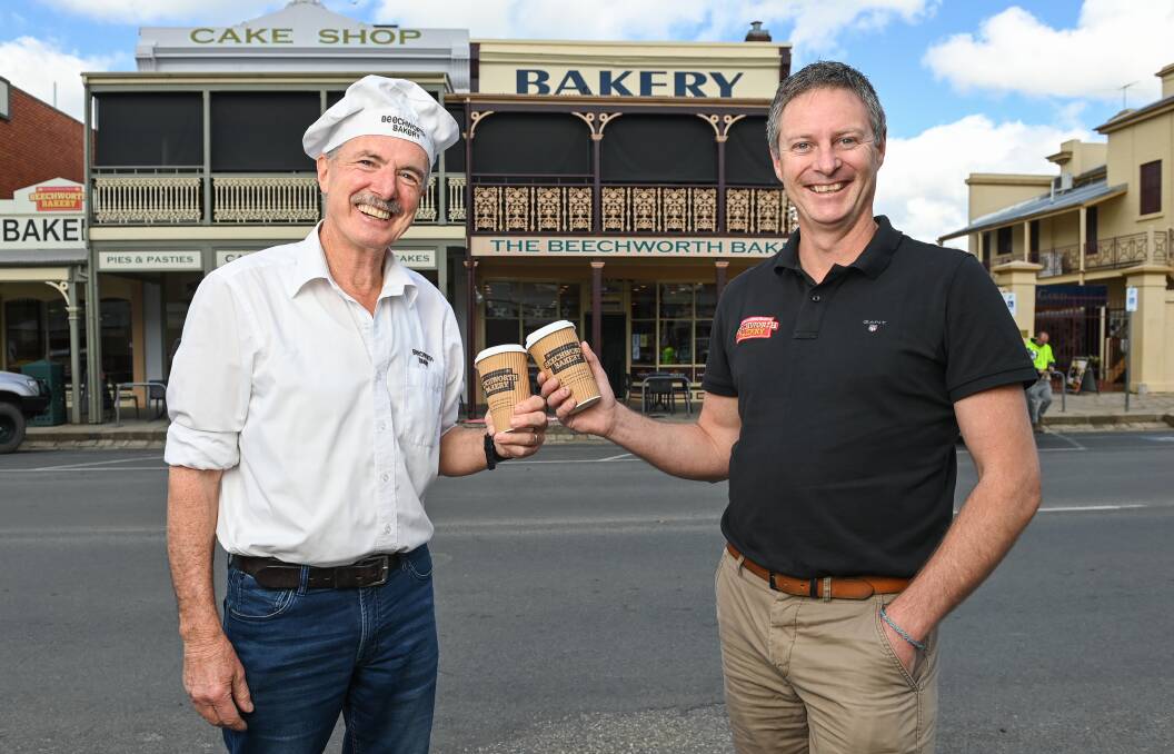 CHEERS: Beechworth Bakery founder Tom O'Toole with owner Marty Matassoni. Pictures: MARK JESSER
