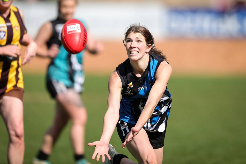 BIG EFFORT: Kaitlin Muscat is at full stretch for the Murray Felines during Sunday's game at Lavington.