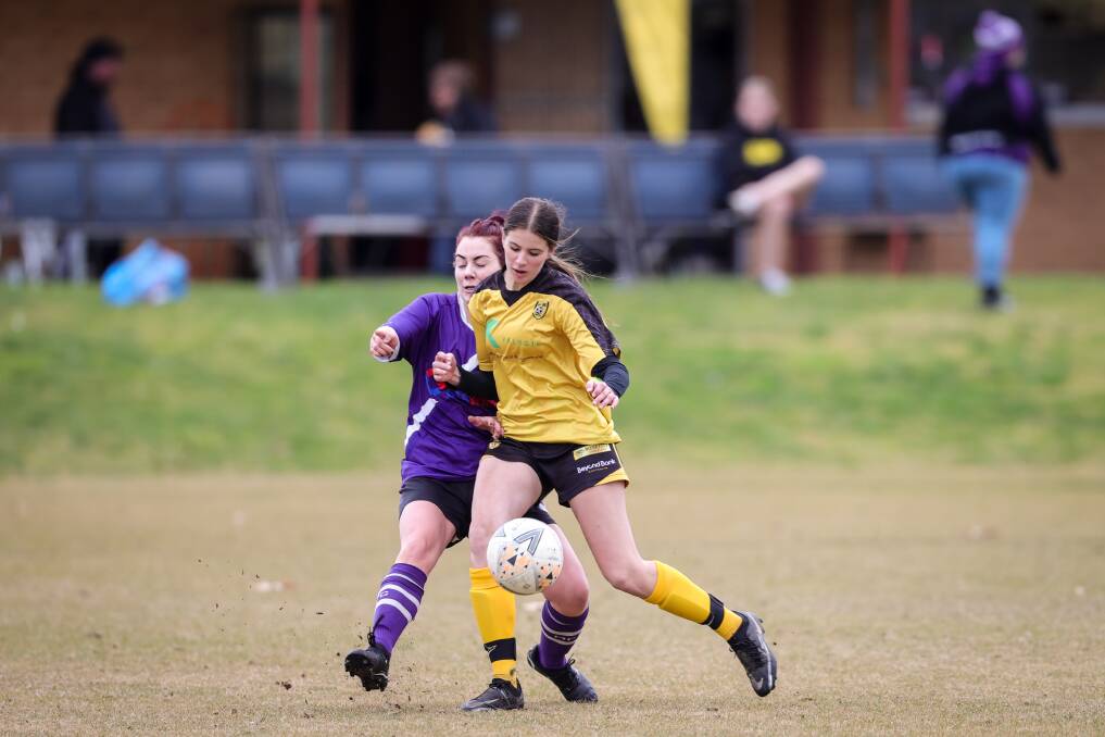 Two-goal Elisha Wild gets her body in front of Melrose's Michele Bent. Picture: JAMES WILTSHIRE