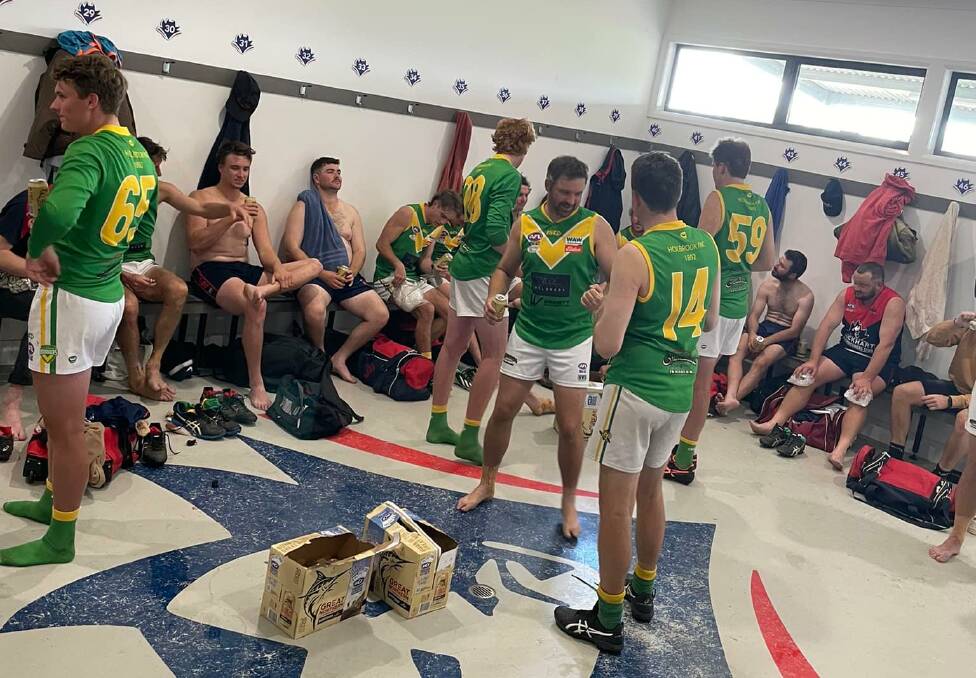 IN THIS TOGETHER: Holbrook players share a beer with their Lockhart counterparts after lending the Demons some players for Saturday's Hume League reserves clash.