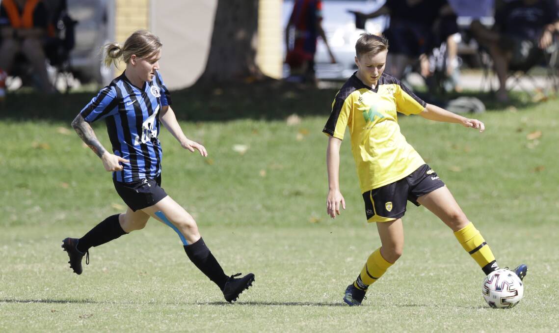 IN CONTROL: Mya Carroll shields the ball from her Myrtleford opponent on a day when Albury Hotspurs showed their class in all departments. Picture: ASH SMITH