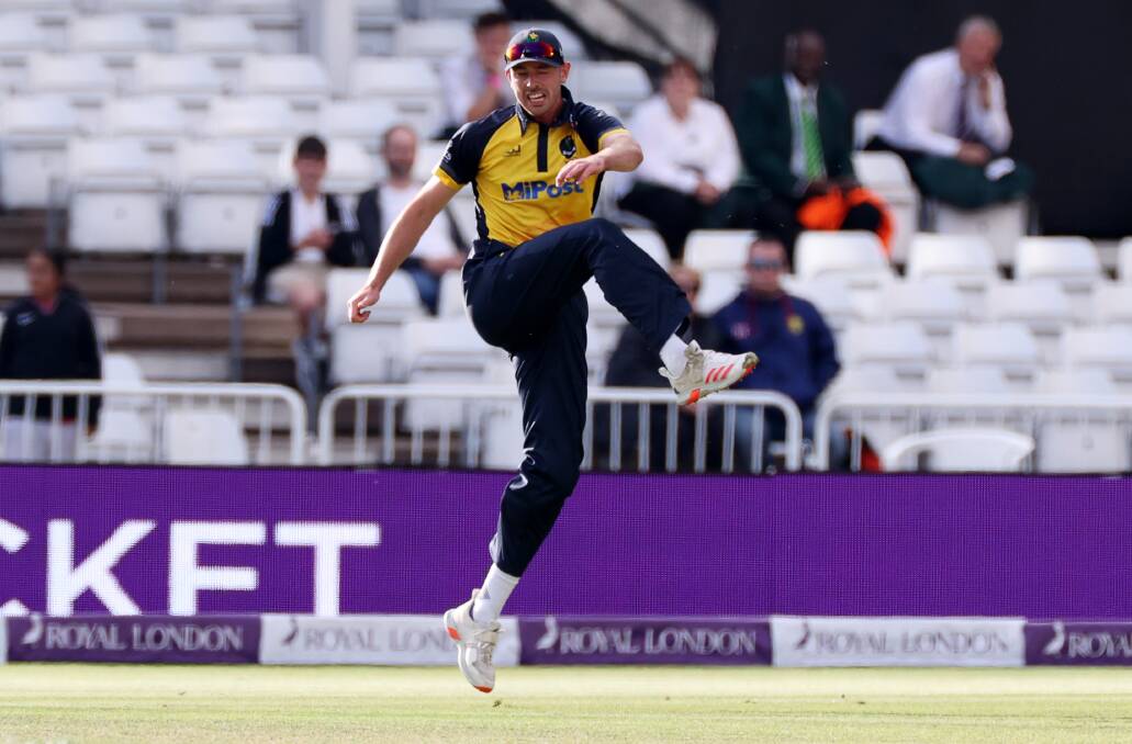 James Weighell boots the ball away after taking a catch during the Durham run-chase.
