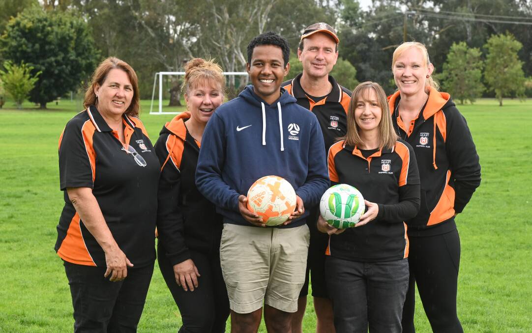 Football Victoria's Abraham Abraham, centre, with Wodonga Heart committee members Penny Wilson, Rose Martin, Anton Maas, Cindy Vilaisarn and Rebbecca Wood. Picture: MARK JESSER