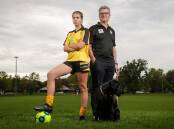 FAMILY CONNECTION: Albury Hotspurs forward Elisha Wild with her father and coach Justin Wild and the family dog Luna. Picture: JAMES WILTSHIRE