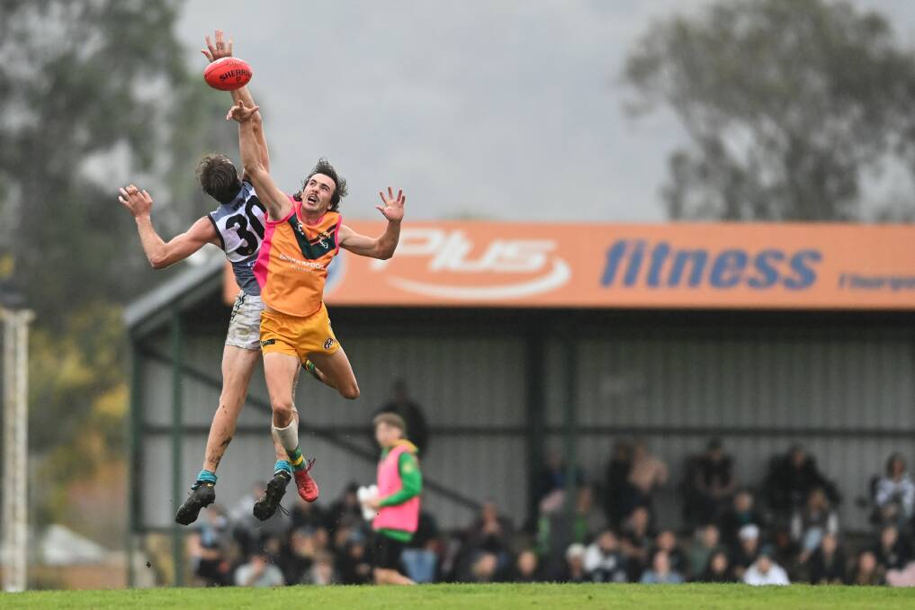 Tim Hanna (30) and North Albury's Will Maclean go head-to-head in the ruck. Picture: MARK JESSER