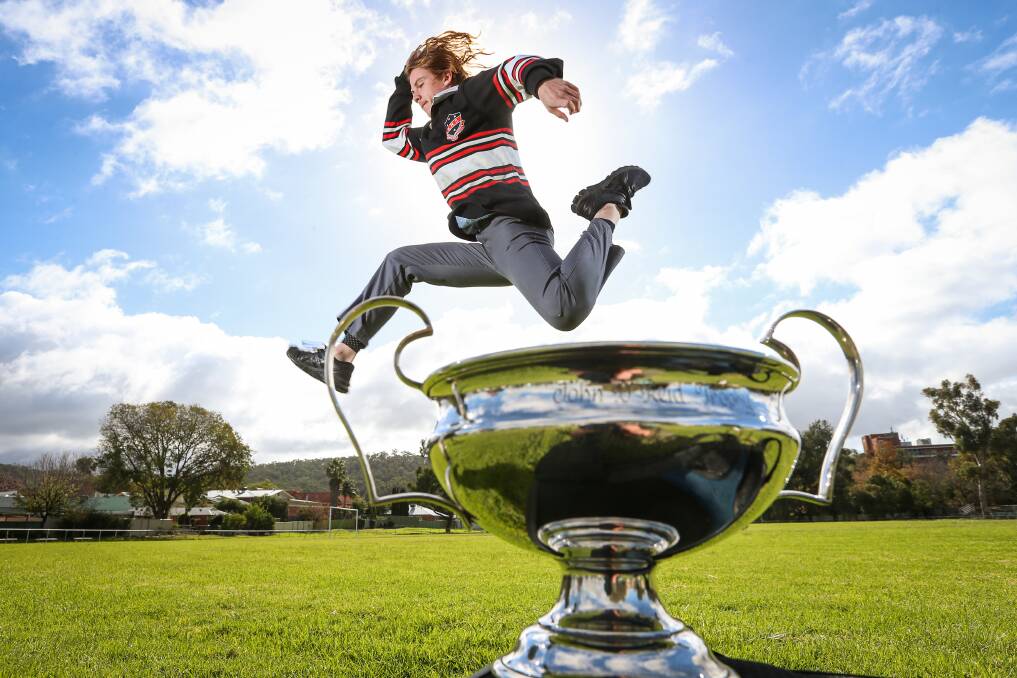 ONE GIANT LEAP: Ethan Talbot leaps over the Albury High School House Cup, named in honour of John Reid, whose long jump record he broke. Picture: JAMES WILTSHIRE
