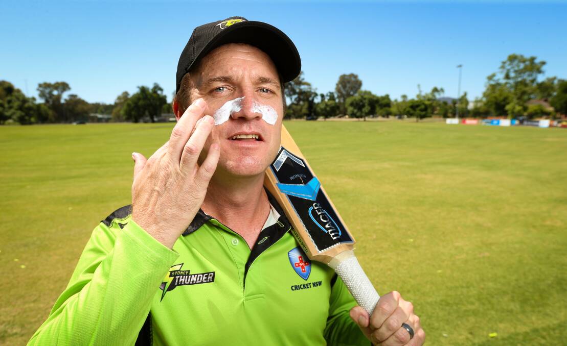 SLIP, SLOP, SLAP: Cricket NSW Murray region manager Jerim Hayes applies his sunscreen before taking the field. Picture: JAMES WILTSHIRE