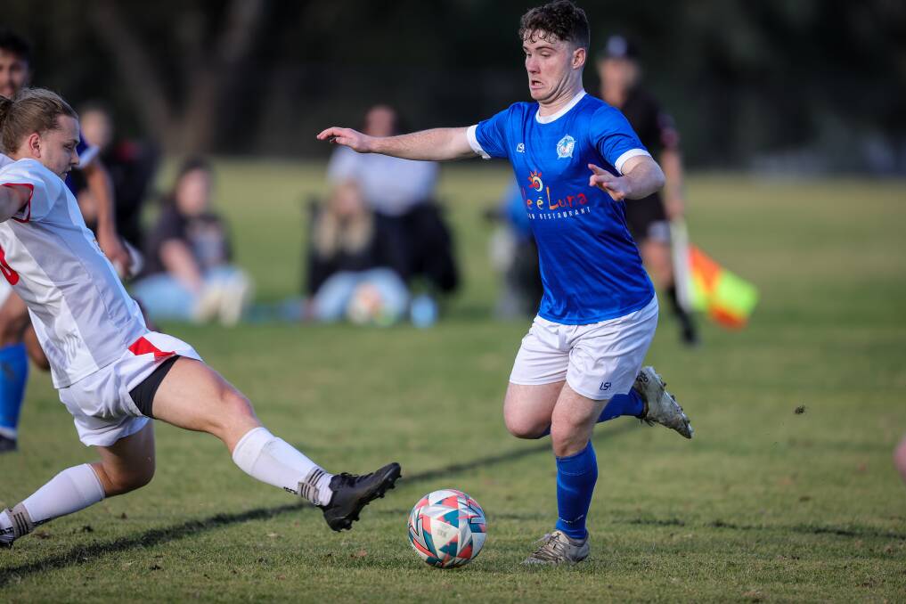 Jack Milford brings the ball through midfield for Myrtleford. Picture: JAMES WILTSHIRE