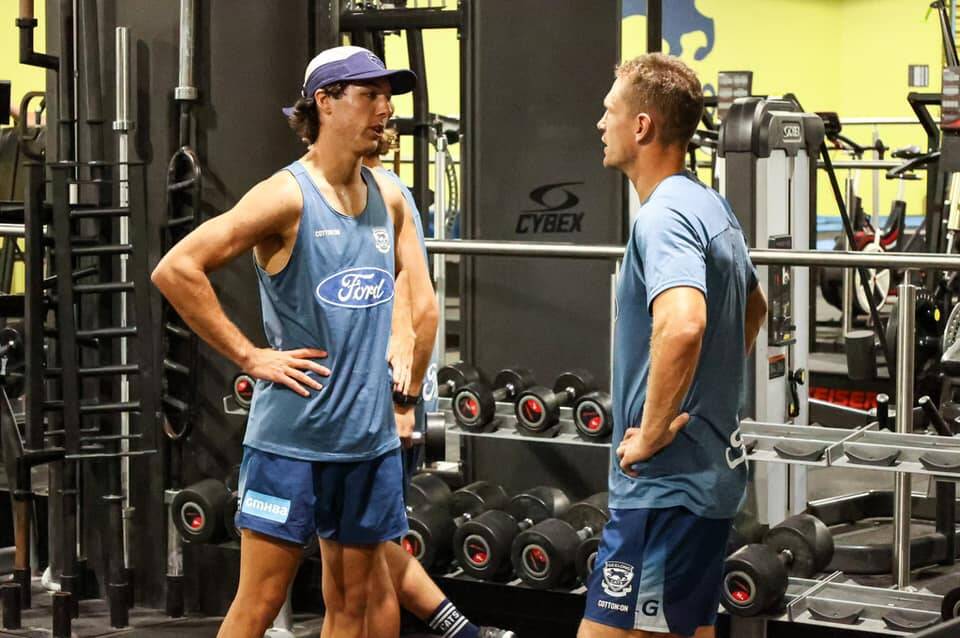 Ollie Hollands gets some advice from Joel Selwood.