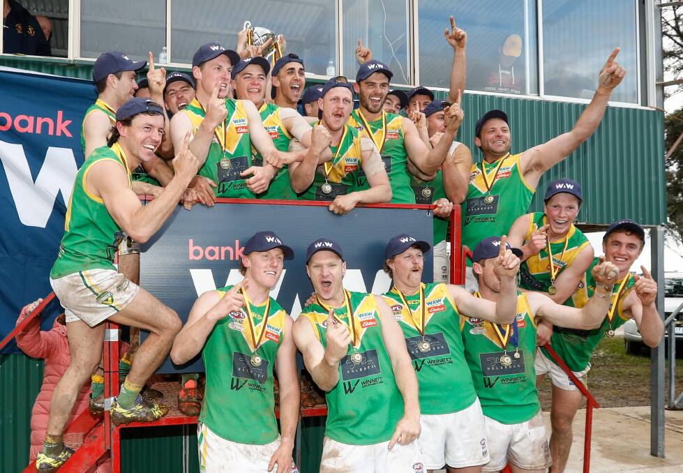 Michael Oates celebrates the 2022 premiership with his Holbrook team-mates. Picture by James Wiltshire