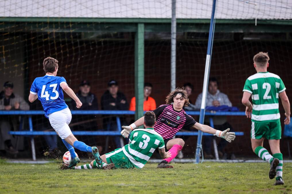 Sam Mason gets there in the nick of time to deny William Osborn. Picture: JAMES WILTSHIRE
