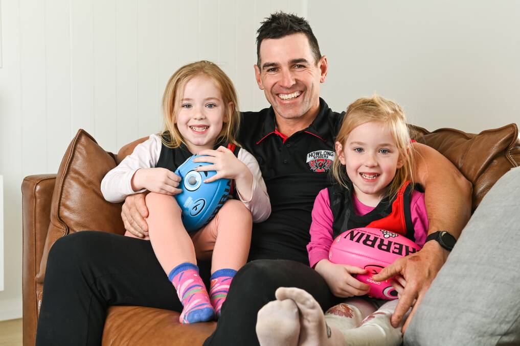 Matt McDonald with his twin daughters Ruby and Mia. Picture by Mark Jesser