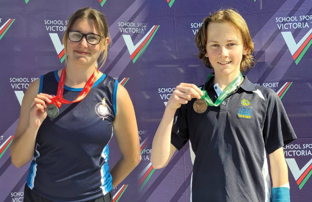 Emma Whalley and John Heinjus show off the medals they won at the School Sport Victoria Track & Field State Championships. Picture by Wodonga Little Athletics Centre