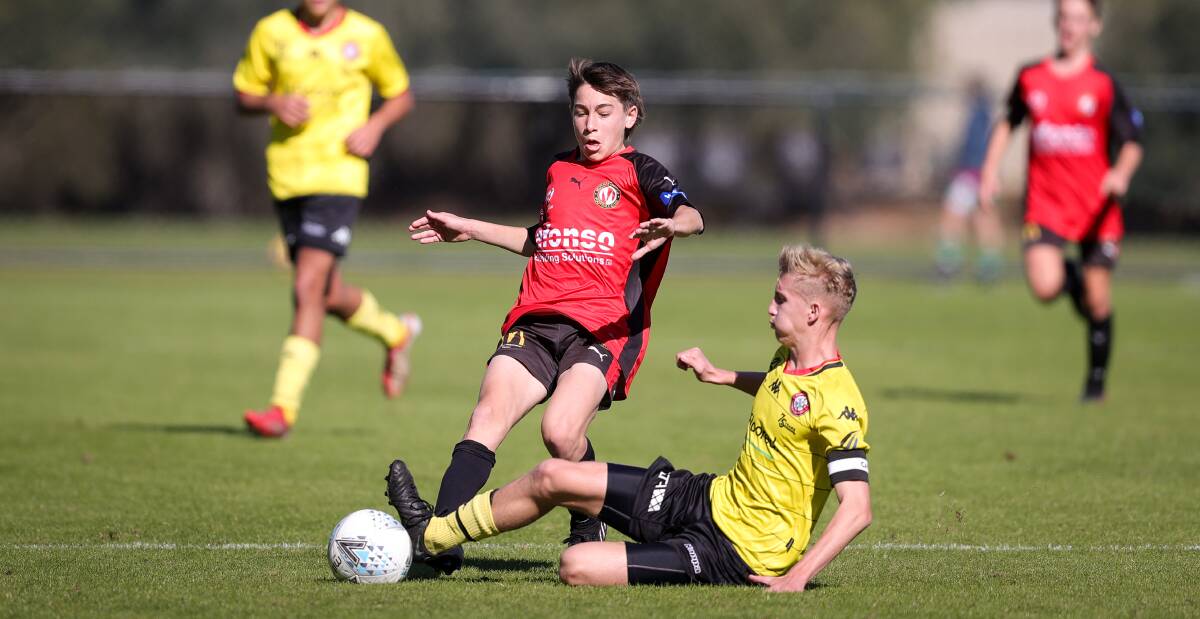 BEST FOOT FORWARD: Murray United's Samuel Noble challenges for the ball with Caroline Springs George Cross captain Jake Richards. Picture: JAMES WILTSHIRE