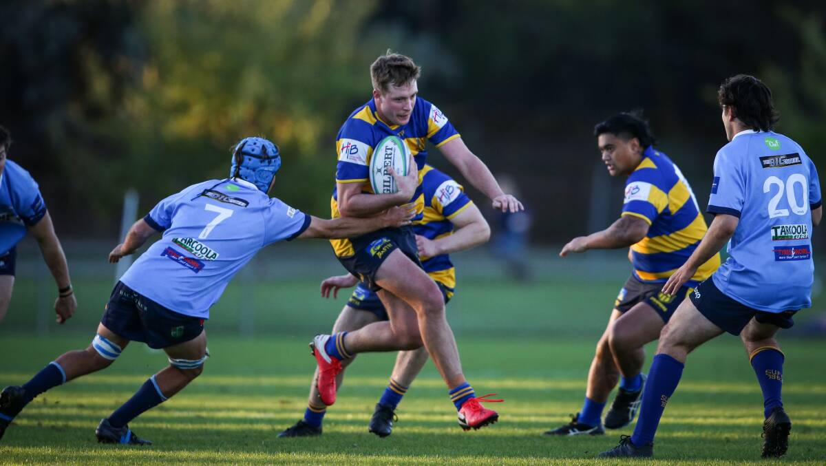 ON THE RUN: George Woods breaks a tackle but he finished on the losing side as the Steamers went down to Waratahs. Picture: JAMES WILTSHIRE