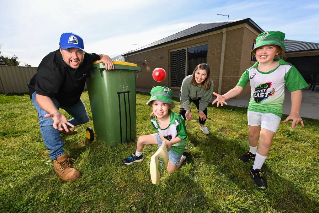 HOWZAT: The field is set for the Biggest Game of Backyard Cricket as Michael Booth, his wife Nicole and their daughters, Matilda, six, and Mackenzie, eight, take up their positions. Picture: MARK JESSER