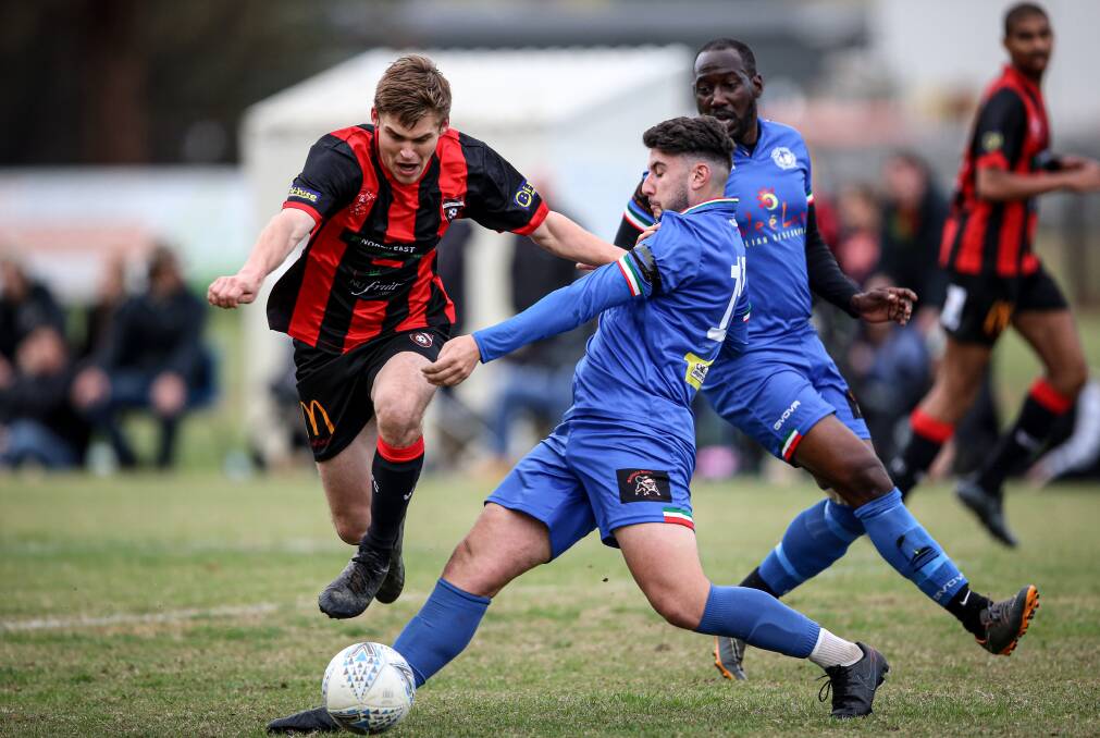 PHASED RETURN: Myrtleford, in blue, plays Albury City on Sunday but Wangaratta, red and black, must wait at least another week for their next game. Picture: JAMES WILTSHIRE