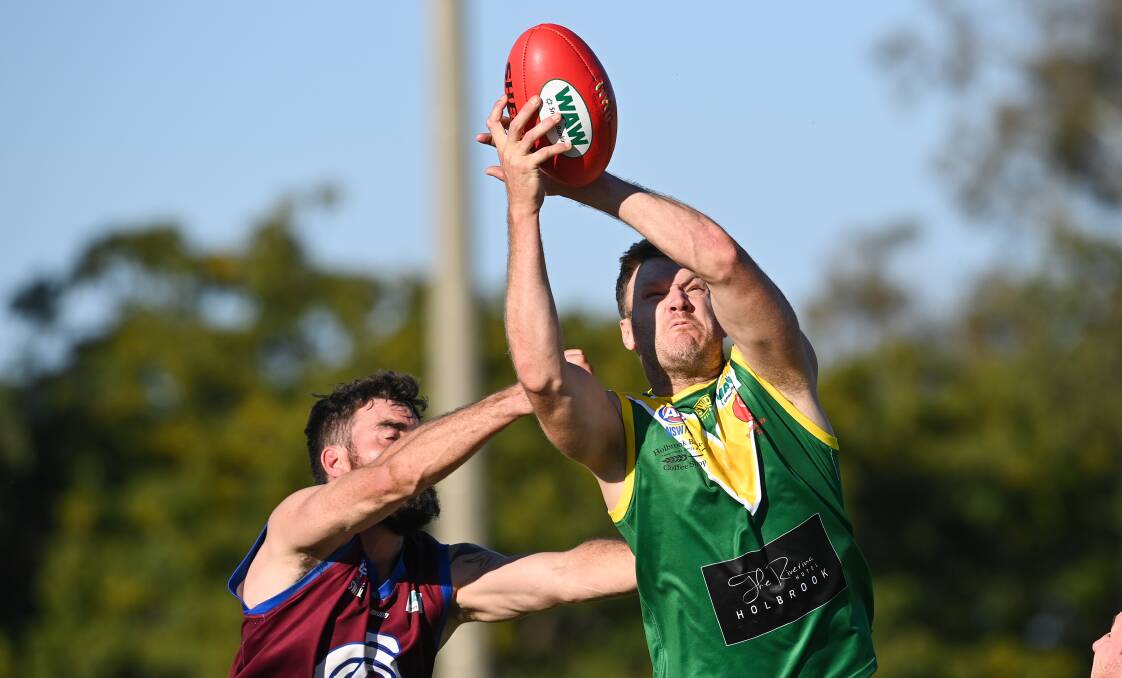 HANDS OFF: Luke Gestier gets up above Culcairn's Kaden Slatter to take a mark for Holbrook on Saturday. The former Lavington man kicked 11 goals on his return from injury, eight of which came in one quarter. Picture: MARK JESSER