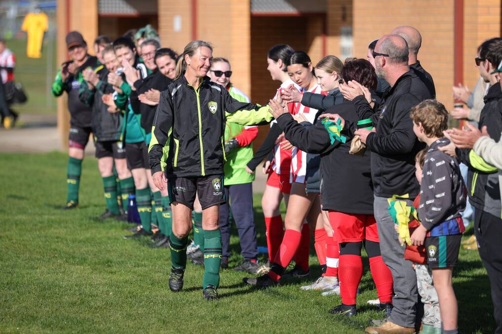 Players from St Pats and Wodonga Diamonds form a guard of honour ahead of Raquel Vogel's last game at Alexandra Park. Picture by James Wiltshire