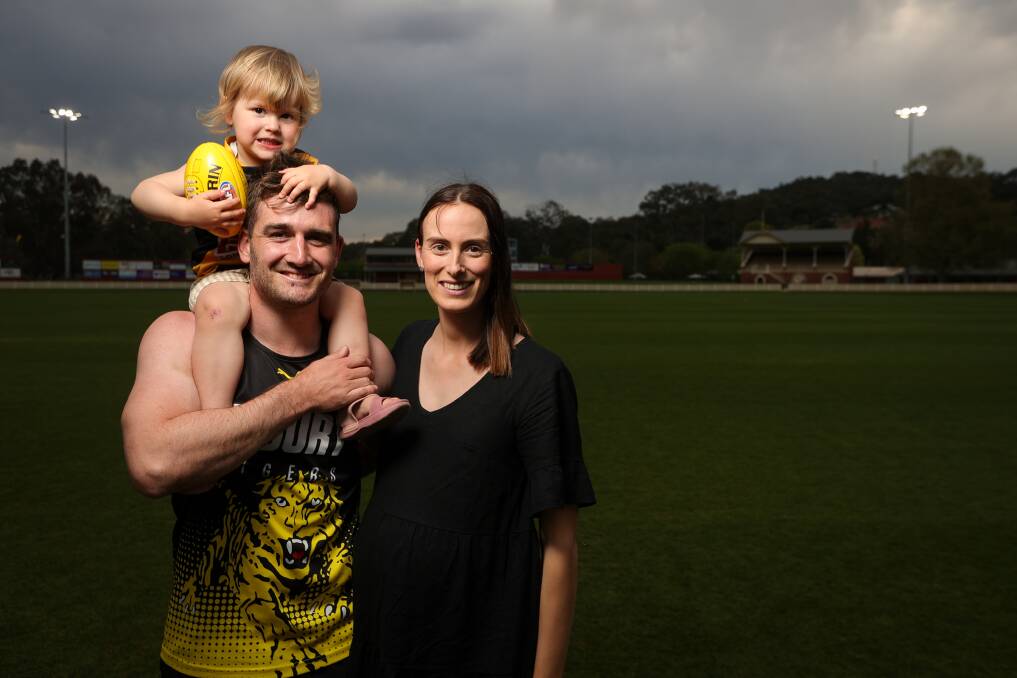 Anthony Miles with daughter Hallie, 2, and wife Laura at Albury Sportsground. Picture by James Wiltshire
