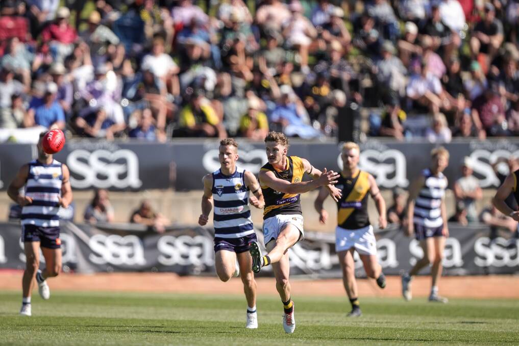 Riley Bice unloads with his left foot against Yarrawonga on grand final day. Picture by James Wiltshire
