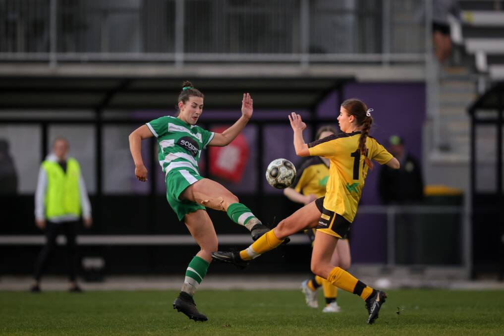 Elisha Wild takes on Albury United captain Allanah Seary during the AWFA cup final at Lavington Sports Ground. Picture by James Wiltshire