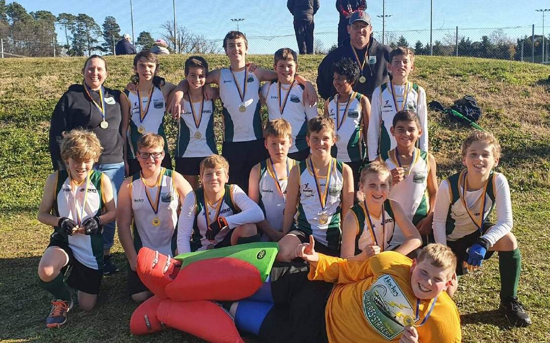 ALL SMILES: Hockey Albury-Wodonga's under-13 boys celebrate their success at the Long Weekend Carnival in Canberra. The under-15 boys were also victorious.