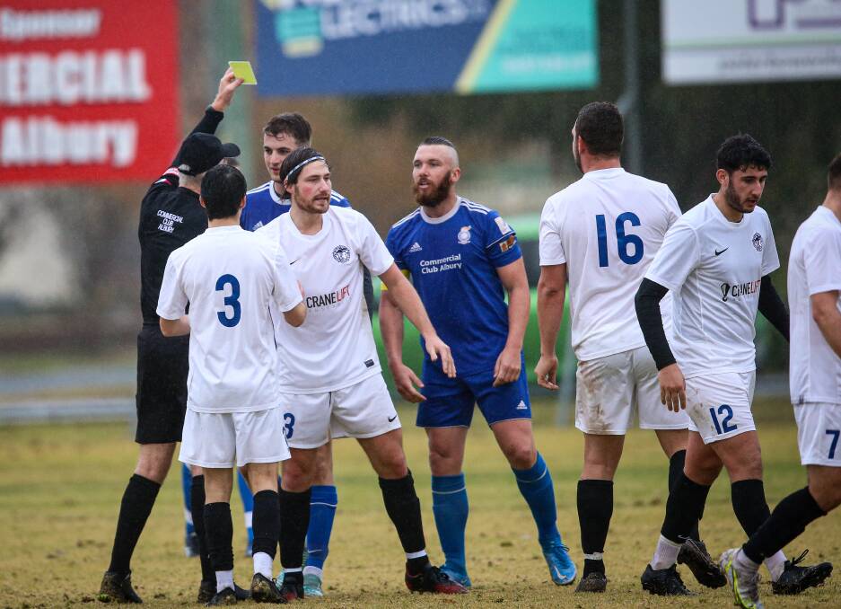 Tempers rise as Albury City's Aaron Young goes into the book for catching Jack Milford late. Picture: JAMES WILTSHIRE