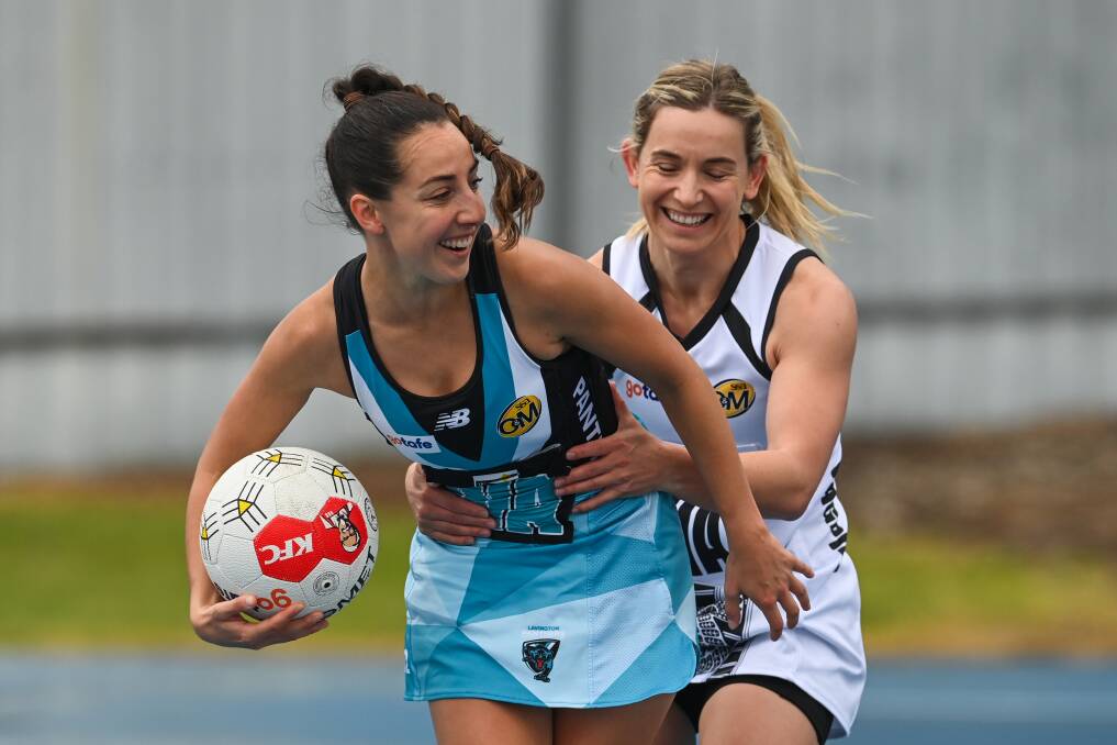 Leah Jenvey prevents Maddi Lloyd from falling over during Saturday's absorbing clash at Lavington Sports Ground. Picture by Mark Jesser