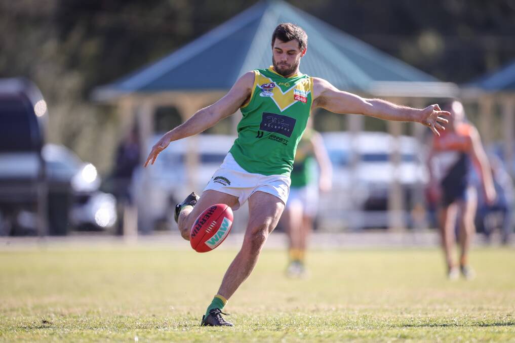 SLICK OPERATOR: Brad Carman gets his kick away for Holbrook against the Giants during the Brookers' win at Walbundrie on Saturday. Picture: JAMES WILTSHIRE