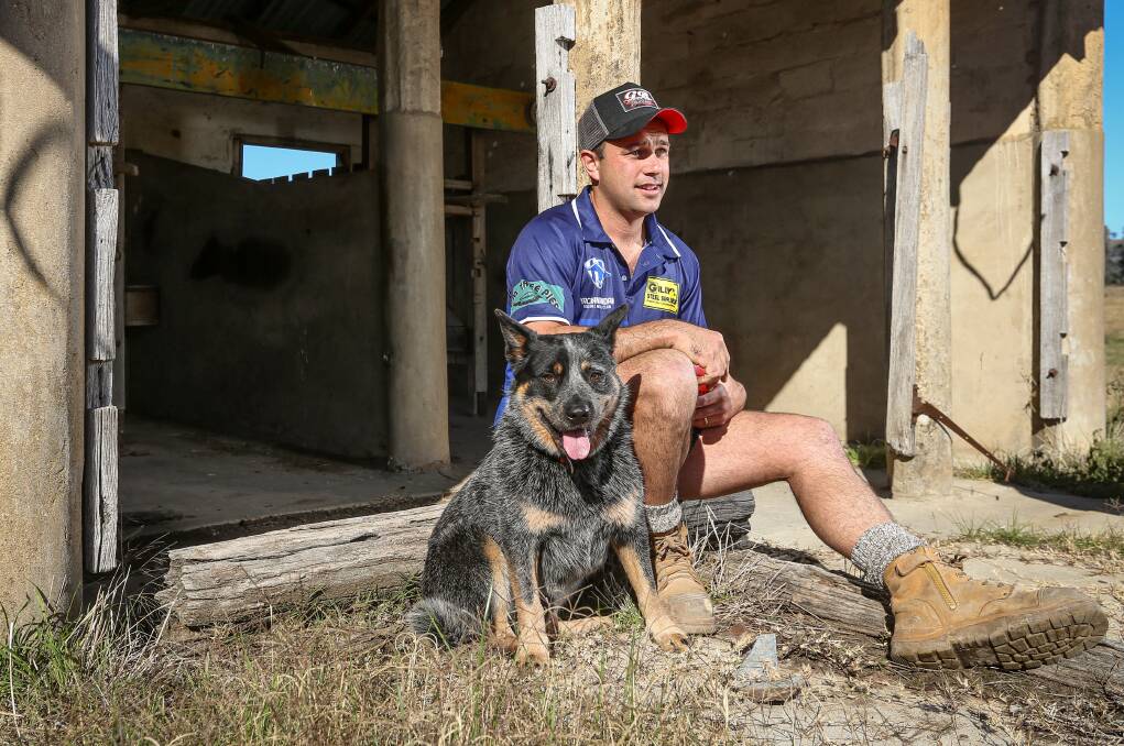 Yackandandah's Josh Garland relaxing at home with his dog. Picture: JAMES WILTSHIRE