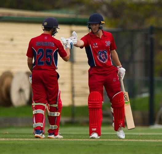 Jack Craig (right) out in the middle for Melbourne.