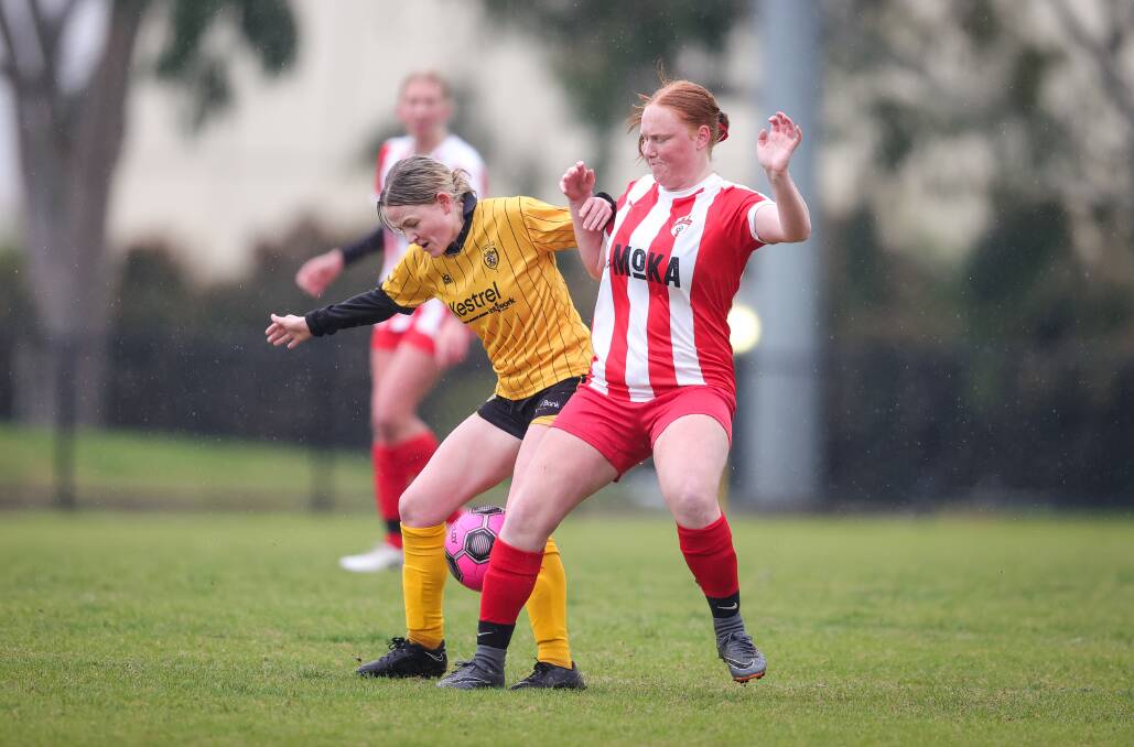 Grace Rowland and Matilda Moorman battle for possession. Picture by James Wiltshire