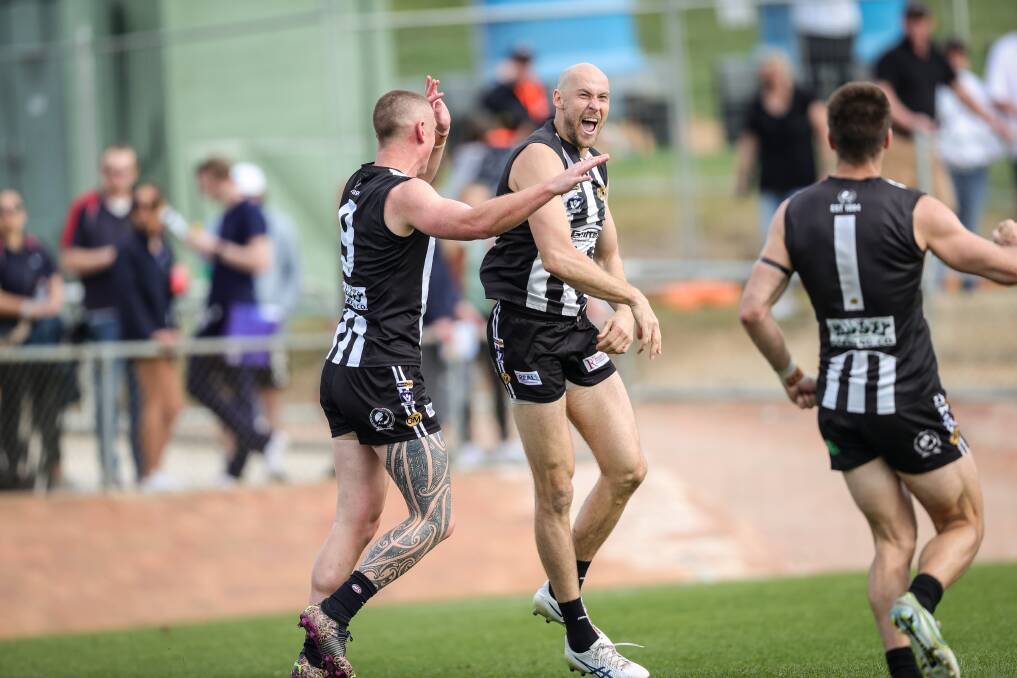Wangaratta coach Ben Reid kicks a goal - and loves it! Picture by James Wiltshire