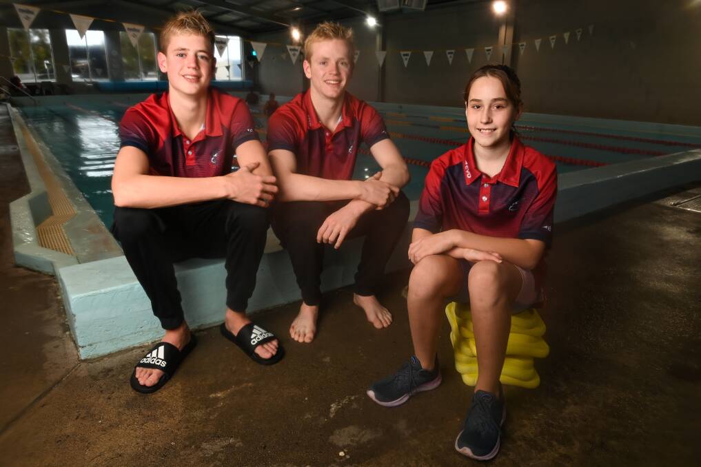 Archie Kreutzberger, 14, Oscar Kreutzberger, 16, and Dorothy Pasko, 12, won a combined 12 medals for North Albury Swimming Club at the Australian Age Championships on the Gold Coast. Picture by Mark Jesser