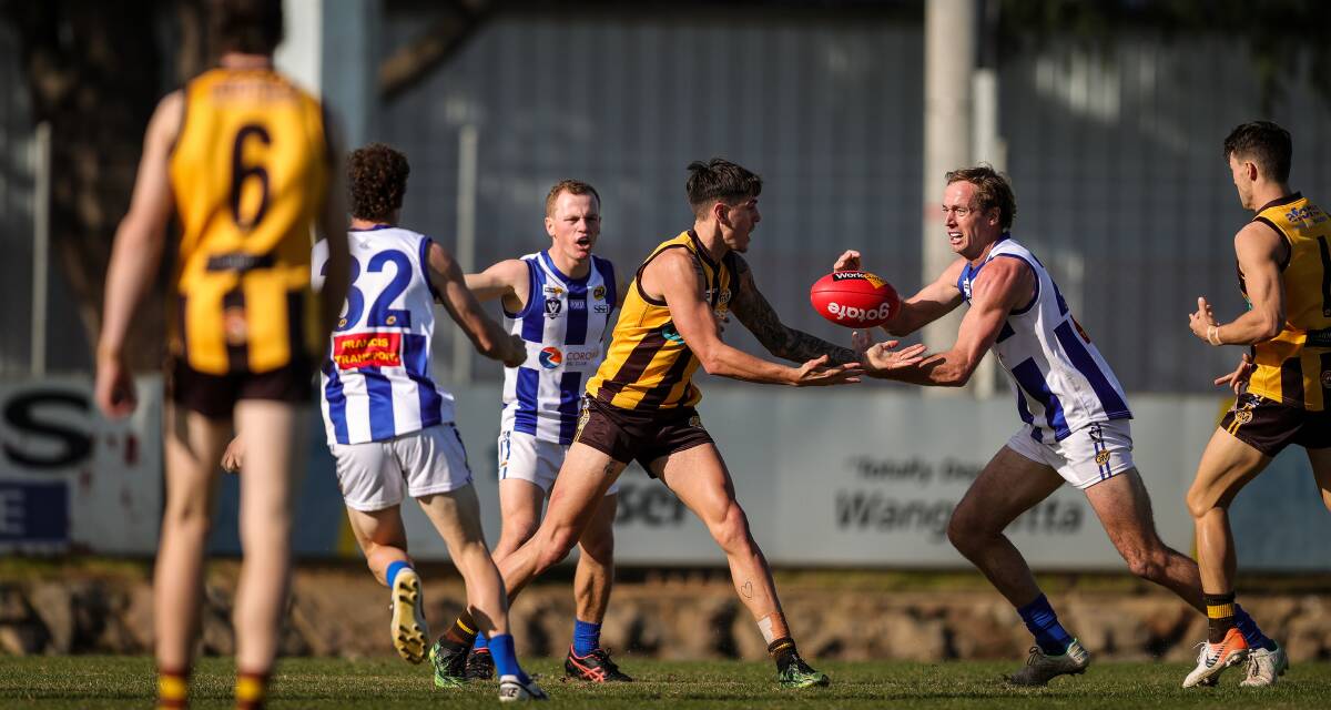 Jarred Lane tussles for the ball with Wangaratta Rovers' Alex Marklew. Picture: JAMES WILTSHIRE