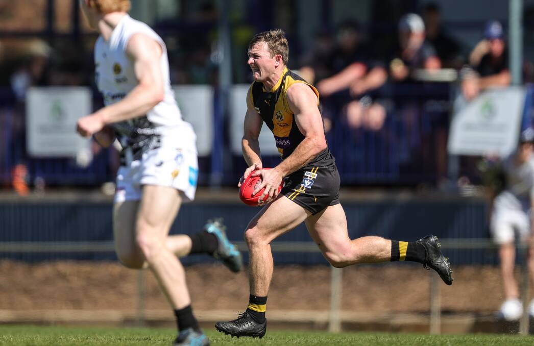 Elliott Powell on the run against Wangaratta in Sunday's preliminary final. Picture by James Wiltshire