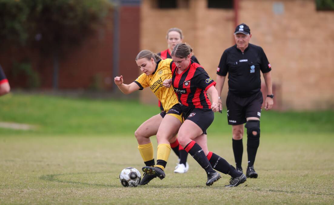 Beth Cope challenges Albury Hotspurs' Ava Tuksar for possession. Picture by James Wiltshire