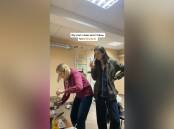 Photographer-turned-TikTok star Valeria Shashenok, 20, watches her mother cook in their bomb shelter in Chernihiv in northern Ukraine in early March. Source: TikTok @valerisssh