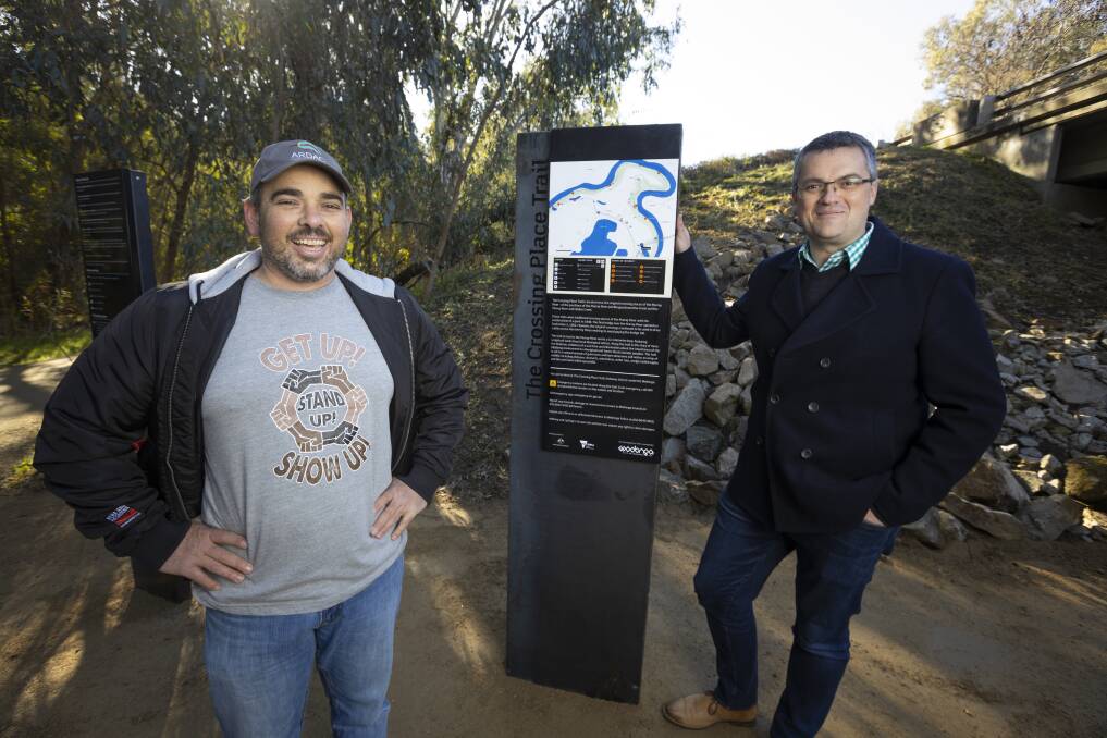 LASTING LEGACY: Wiradjuri artist Mick Bogie with Wodonga mayor Kev Poulton at the opening of The Crossing Trail at Gateway Island. The walking trail features sculptures created by local Indigenous artists. Picture: ASH SMITH