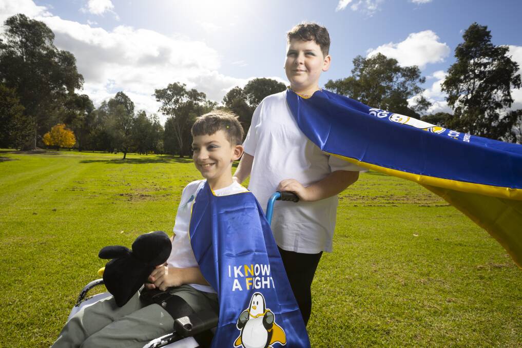 EVERYDAY HEROES: Wodonga Primary School students and siblings Liam, 10, and Sage Wilson, 12, are taking part in fundraisers and showing off their colourful costumes for NF Awareness Month throughout May. Picture: ASH SMITH
